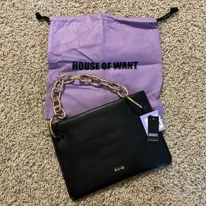 Black vegan clutch with beautiful gold link strap.